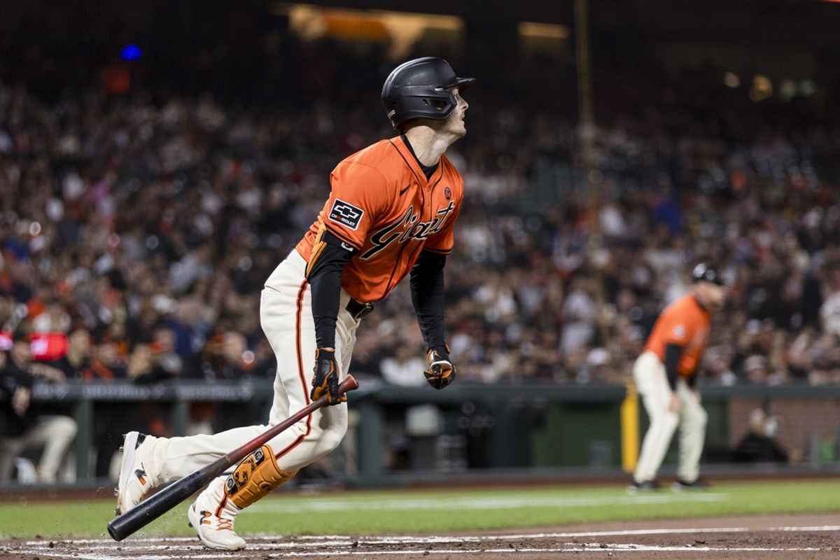 Aug 30, 2024; San Francisco, California, USA; San Francisco Giants right fielder Mike Yastrzemski (5) hits a single against the Miami Marlins during the third inning at Oracle Park. Mandatory Credit: John Hefti-USA TODAY Sports