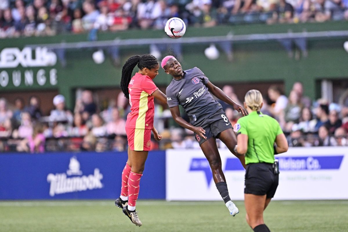 Aug 30, 2024; Portland, Oregon, USA; Portland Thorns FC defender Isabella Obaze (5) and Bay FC forward Asisat Oshoala (8) both go up for a header during the first half at Providence Park. Mandatory Credit: Troy Wayrynen-USA TODAY Sports