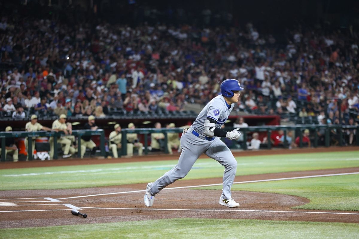 Los Angeles Dodgers designated hitter Shohei Ohtani (17) runs out of the batters box Aug. 30, 2024 at Chase Field in Phoenix.