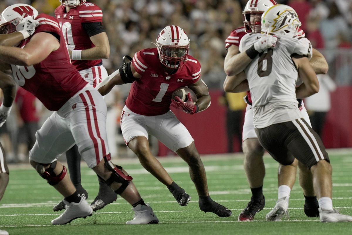 Wisconsin running back Chez Mellusi (1) finds a hole in the Western Michigan defense during the second quarter of their game Friday, August 30, 2024 at Camp Randall Stadium in Madison, Wisconsin.