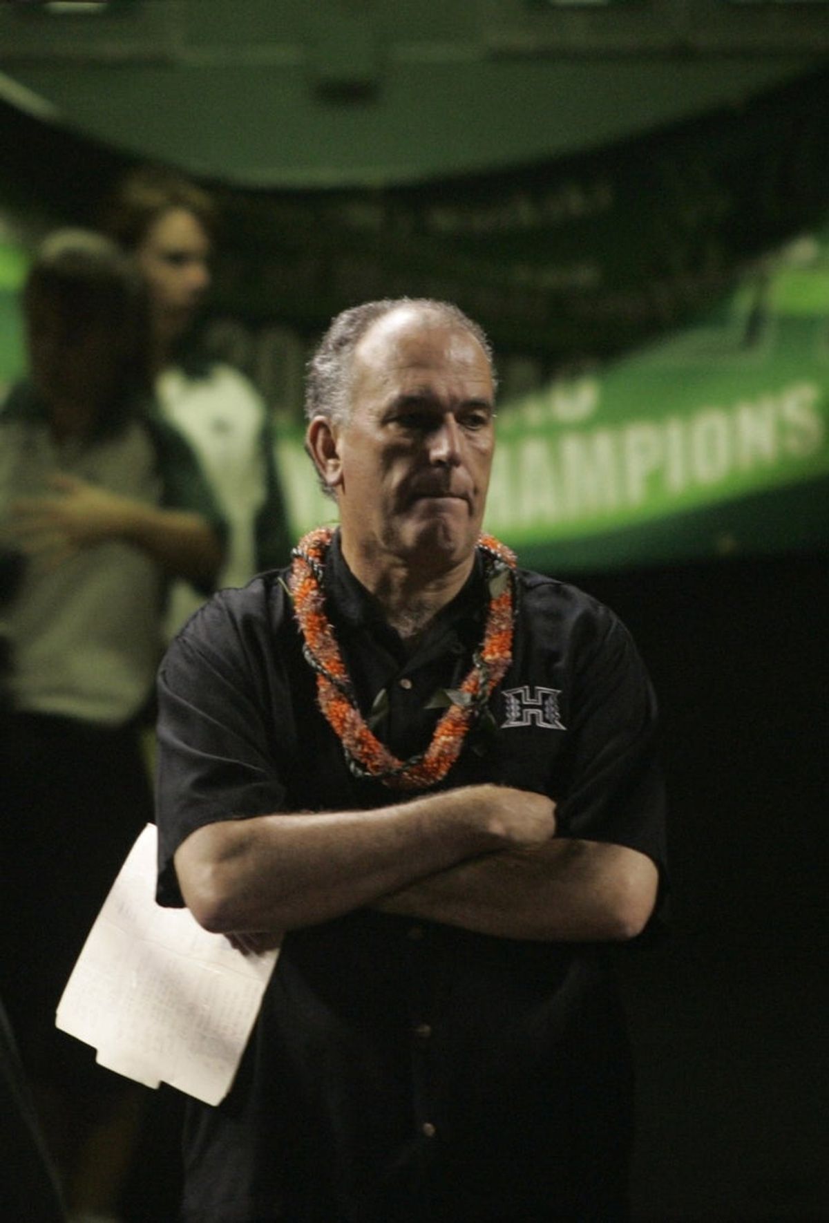 Hawaii Warriors head coach June Jones waits for his players to be introduced to the field before their game against the Washington Huskies at Aloha Stadium.