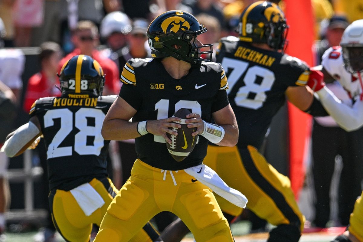 Aug 31, 2024; Iowa City, Iowa, USA; Iowa Hawkeyes quarterback Cade McNamara (12) drops back to pass during the first quarter against the Illinois State Redbirds at Kinnick Stadium. Mandatory Credit: Jeffrey Becker-USA TODAY Sports