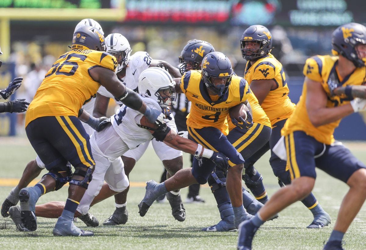 Aug 31, 2024; Morgantown, West Virginia, USA; West Virginia Mountaineers running back CJ Donaldson Jr. (4) runs the ball during the second quarter against the Penn State Nittany Lions at Mountaineer Field at Milan Puskar Stadium. Mandatory Credit: Ben Queen-USA TODAY Sports