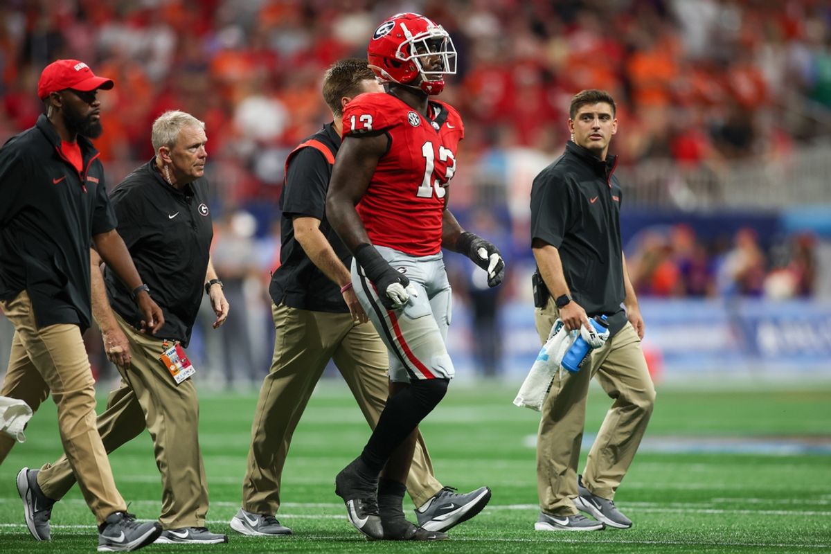 Aug 31, 2024; Atlanta, Georgia, USA; Georgia Bulldogs defensive lineman Mykel Williams (13) goes off the field with an injury against the Clemson Tigers in the third quarter at Mercedes-Benz Stadium. Mandatory Credit: Brett Davis-USA TODAY Sports