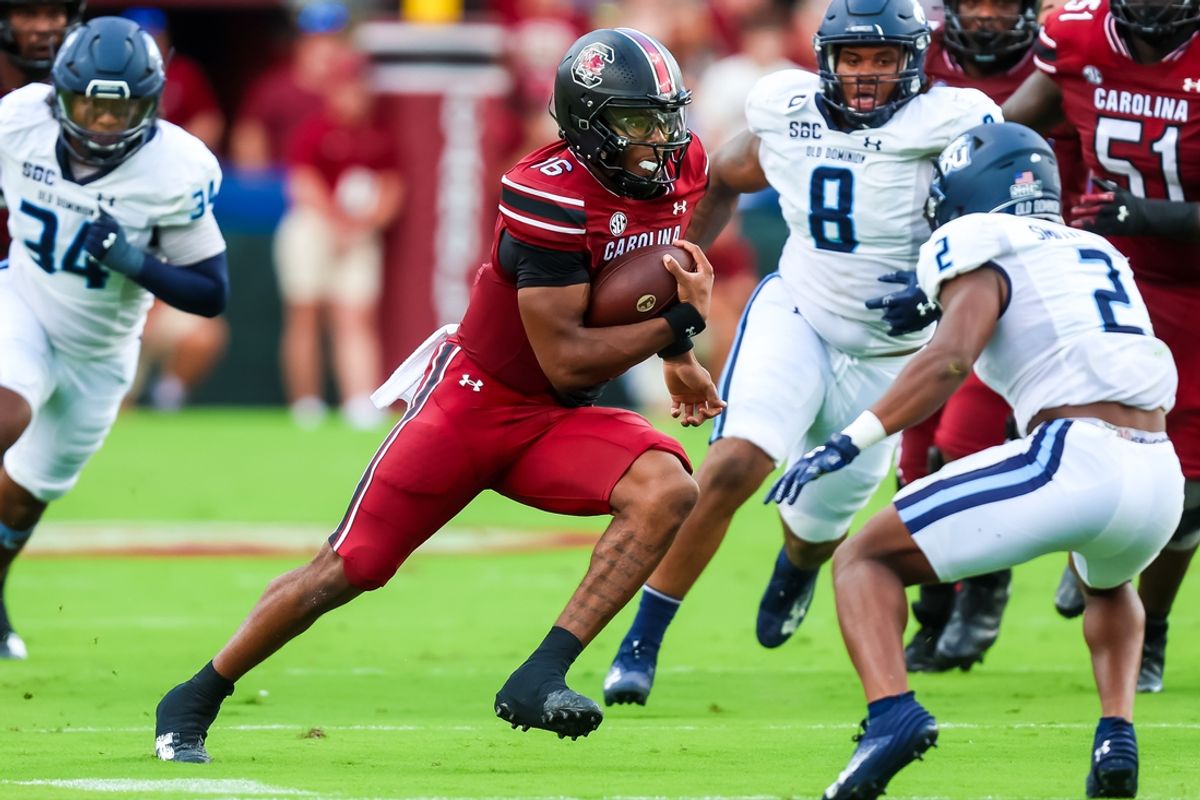 Aug 31, 2024; Columbia, South Carolina, USA; South Carolina Gamecocks quarterback LaNorris Sellers (16) runs the ball against Old Dominion Monarchs safety Patrick Smith-Young (2) in the first quarter at Williams-Brice Stadium. Mandatory Credit: Jeff Blake-Imagn Images