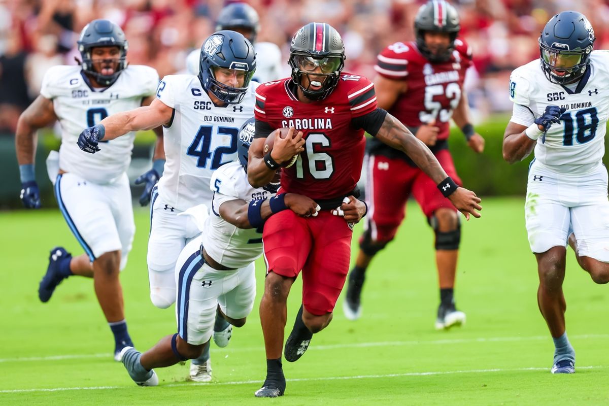 Aug 31, 2024; Columbia, South Carolina, USA; South Carolina Gamecocks quarterback LaNorris Sellers (16) is tackled by Old Dominion Monarchs safety Jahron Manning (5) in the first quarter at Williams-Brice Stadium. Mandatory Credit: Jeff Blake-USA TODAY Sports