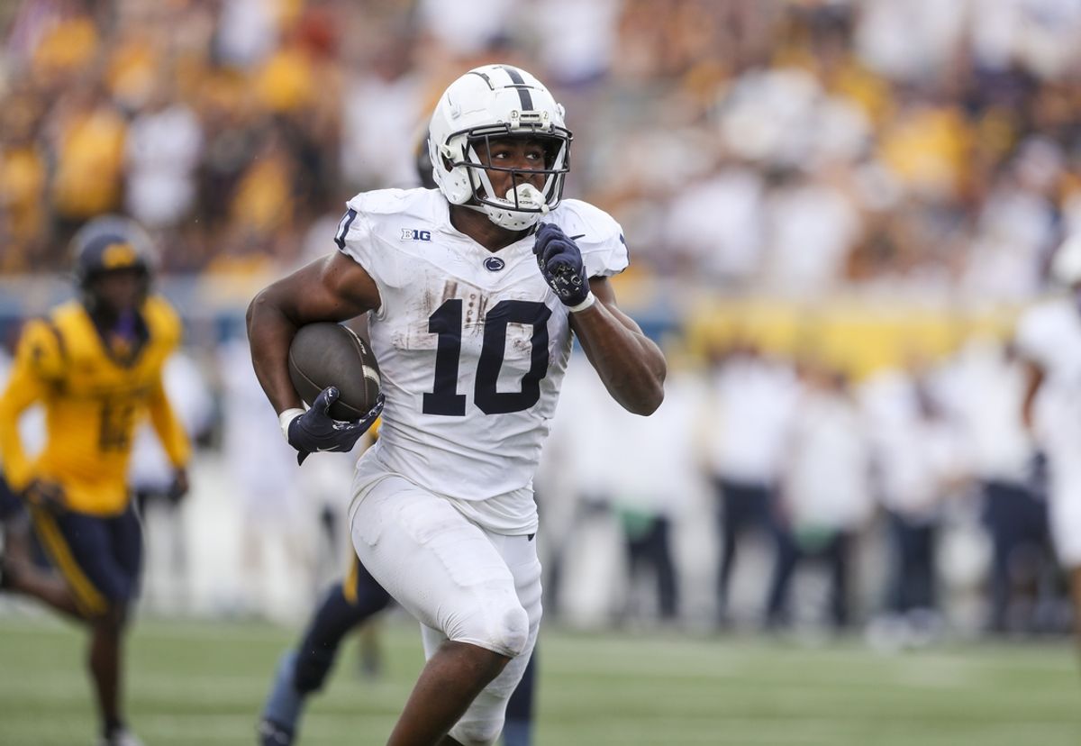 Aug 31, 2024; Morgantown, West Virginia, USA; Penn State Nittany Lions running back Nicholas Singleton (10) runs the ball for a touchdown during the third quarter against the West Virginia Mountaineers at Mountaineer Field at Milan Puskar Stadium. Mandatory Credit: Ben Queen-Imagn Images