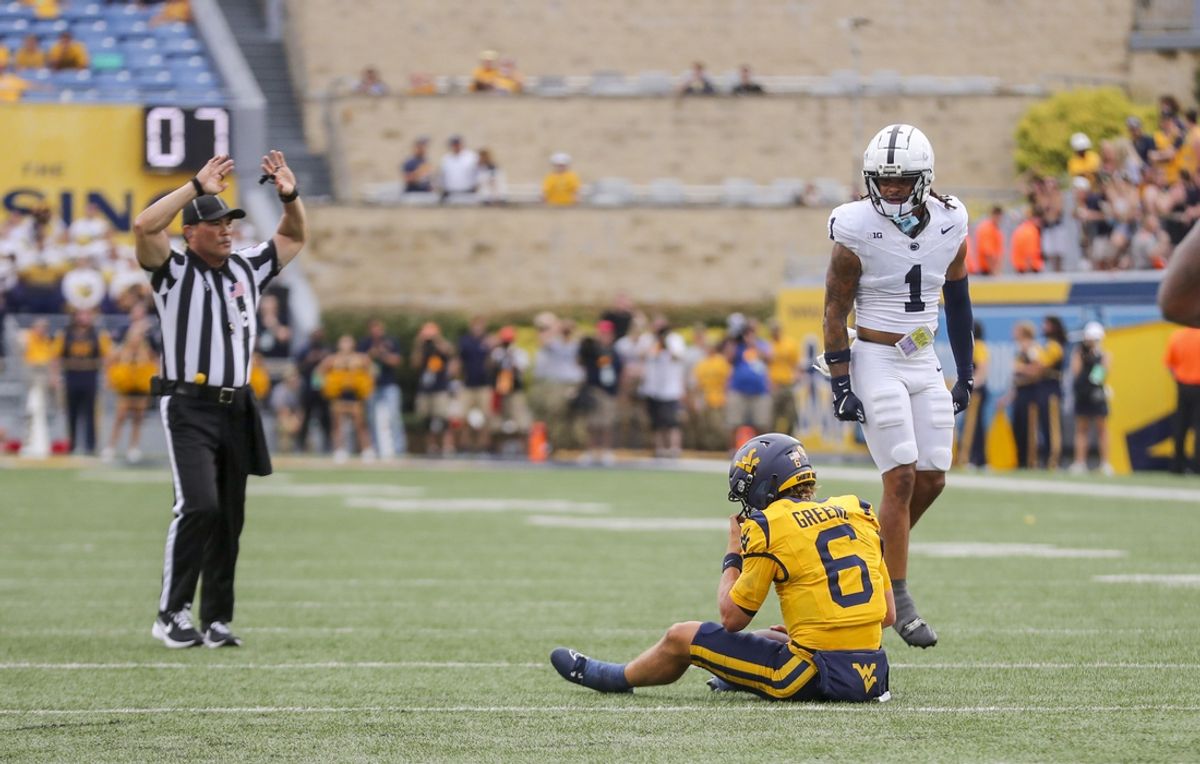 Aug 31, 2024; Morgantown, West Virginia, USA; West Virginia Mountaineers quarterback Garrett Greene (6) is sacked on the two point conversion attempt during the fourth quarter against the Penn State Nittany Lions at Mountaineer Field at Milan Puskar Stadium. Mandatory Credit: Ben Queen-Imagn Images