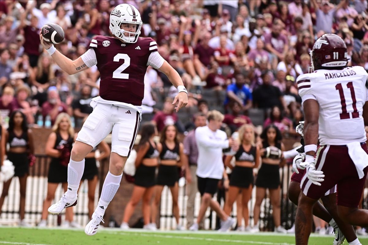 Aug 31, 2024; Starkville, Mississippi, USA; Mississippi State Bulldogs quarterback Blake Shapen (2) jumps into the endzone against Eastern Kentucky Colonels linebacker Maddox Marcellus (11) during the first quarter at Davis Wade Stadium at Scott Field. Mandatory Credit: Matt Bush-USA TODAY Sports