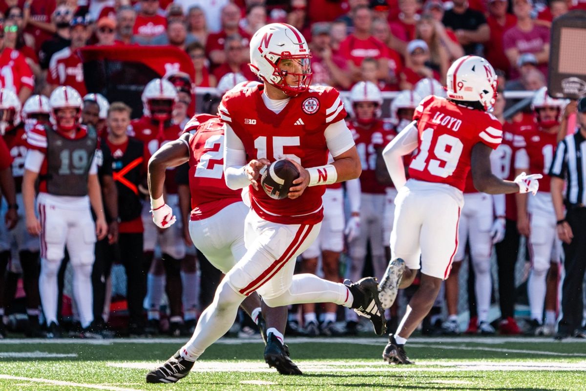 Aug 31, 2024; Lincoln, Nebraska, USA; Nebraska Cornhuskers quarterback Dylan Raiola (15) rolls out to pass against the UTEP Miners during the third quarter at Memorial Stadium. Mandatory Credit: Dylan Widger-Imagn Images