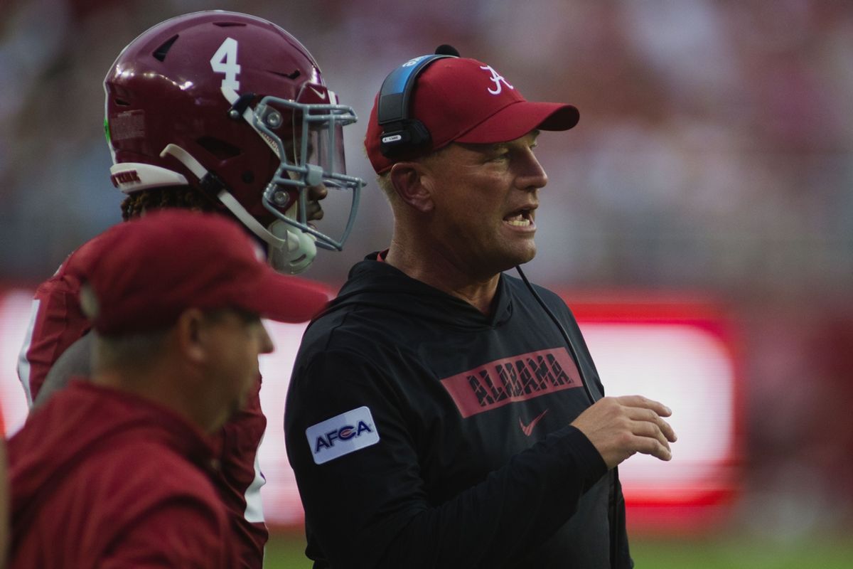 Alabama Crimson Tide head coach Kalen DeBoer talks to Alabama Crimson Tide quarterback Jalen Milroe (4) after scoring a touchdown against Western Kentucky Hilltoppers during the first quarter at Bryant-Denny Stadium. Mandatory Credit: Will McLelland-Imagn Images