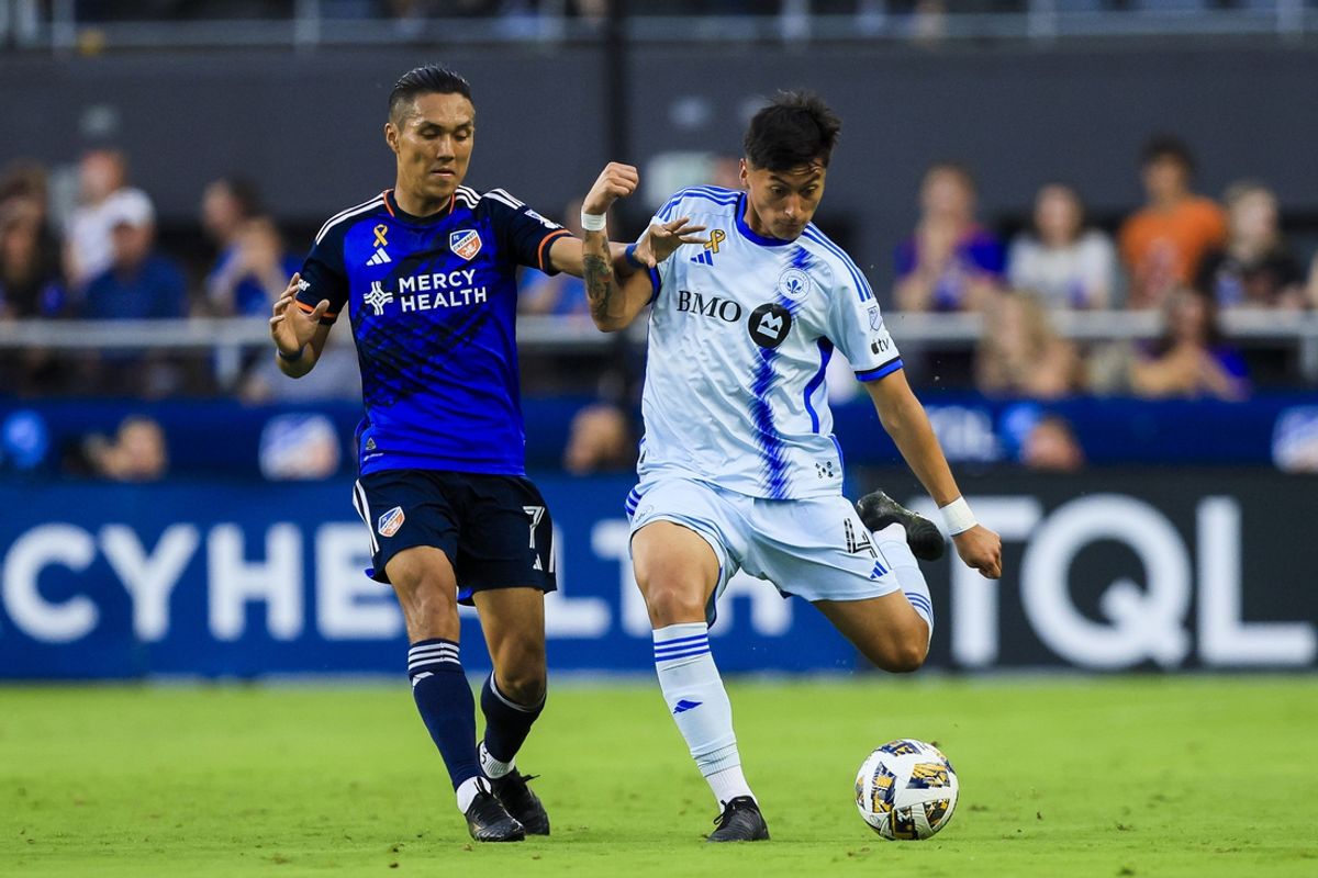 Aug 31, 2024; Cincinnati, Ohio, USA; FC Cincinnati forward Yuya Kubo (7) battles for the ball against CF Montreal defender Fernando Alvarez (4) in the first half at TQL Stadium. Mandatory Credit: Katie Stratman-USA TODAY Sports