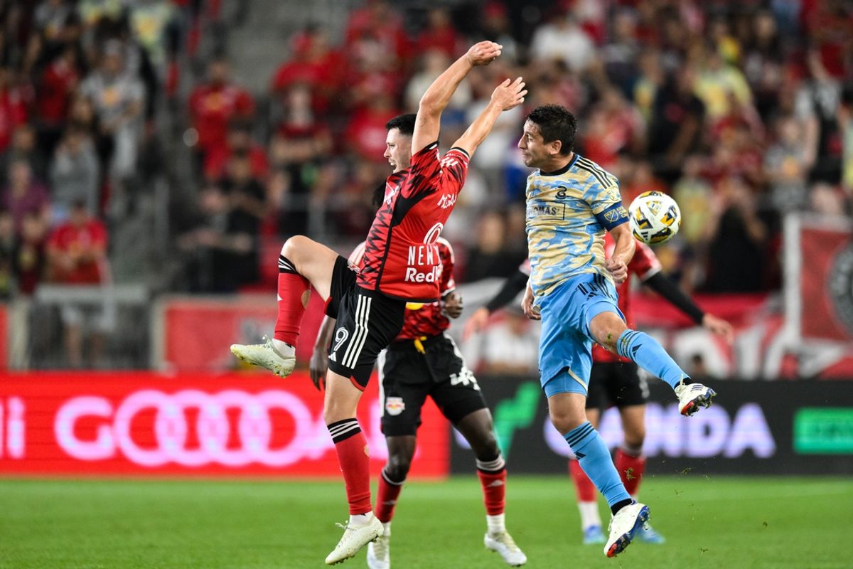 Aug 31, 2024; Harrison, New Jersey, USA; New York Red Bulls midfielder Lewis Morgan (9) competes for the ball against Philadelphia Union midfielder Alejandro Bedoya (11) during the first half at Red Bull Arena. Mandatory Credit: John Jones-USA TODAY Sports