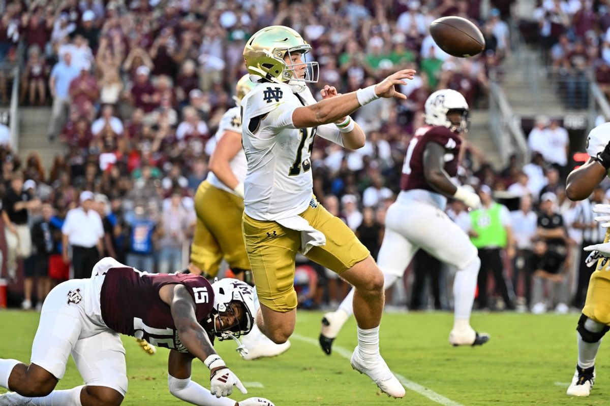 Aug 31, 2024; College Station, Texas, USA; Notre Dame Fighting Irish quarterback Riley Leonard (13) throws a pass under pressure from Texas A&M Aggies quarterback Conner Weigman (15) during the first quarter at Kyle Field. Mandatory Credit: Maria Lysaker-USA TODAY Sports