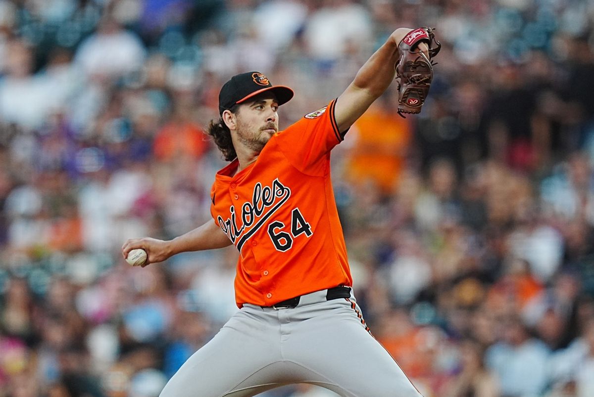 Aug 31, 2024; Denver, Colorado, USA; Baltimore Orioles starting pitcher Dean Kremer (64) delivers a pitch in the fourth inning against the Colorado Rockies at Coors Field. Mandatory Credit: Ron Chenoy-USA TODAY Sports