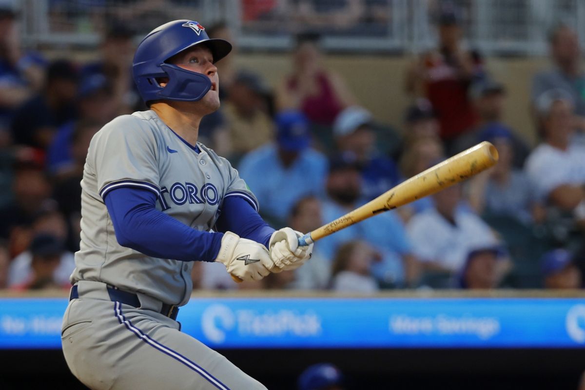 Aug 31, 2024; Minneapolis, Minnesota, USA; Toronto Blue Jays second baseman Will Wagner (7) follows through on a solo home run against the Minnesota Twins in the sixth inning at Target Field. Mandatory Credit: Bruce Kluckhohn-USA TODAY Sports