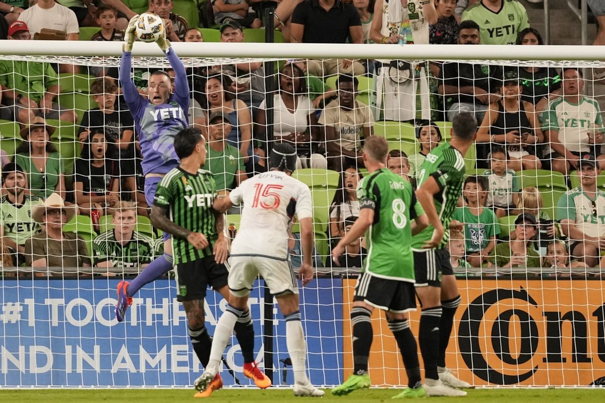 Aug 31, 2024; Austin, Texas, USA;  Austin FC goalkeeper Brad Stuver (1) reaches for the ball during the second half after a shot on net by Vancouver Whitecaps FC at Q2 Stadium. Mandatory Credit: Scott Wachter-USA TODAY Sports