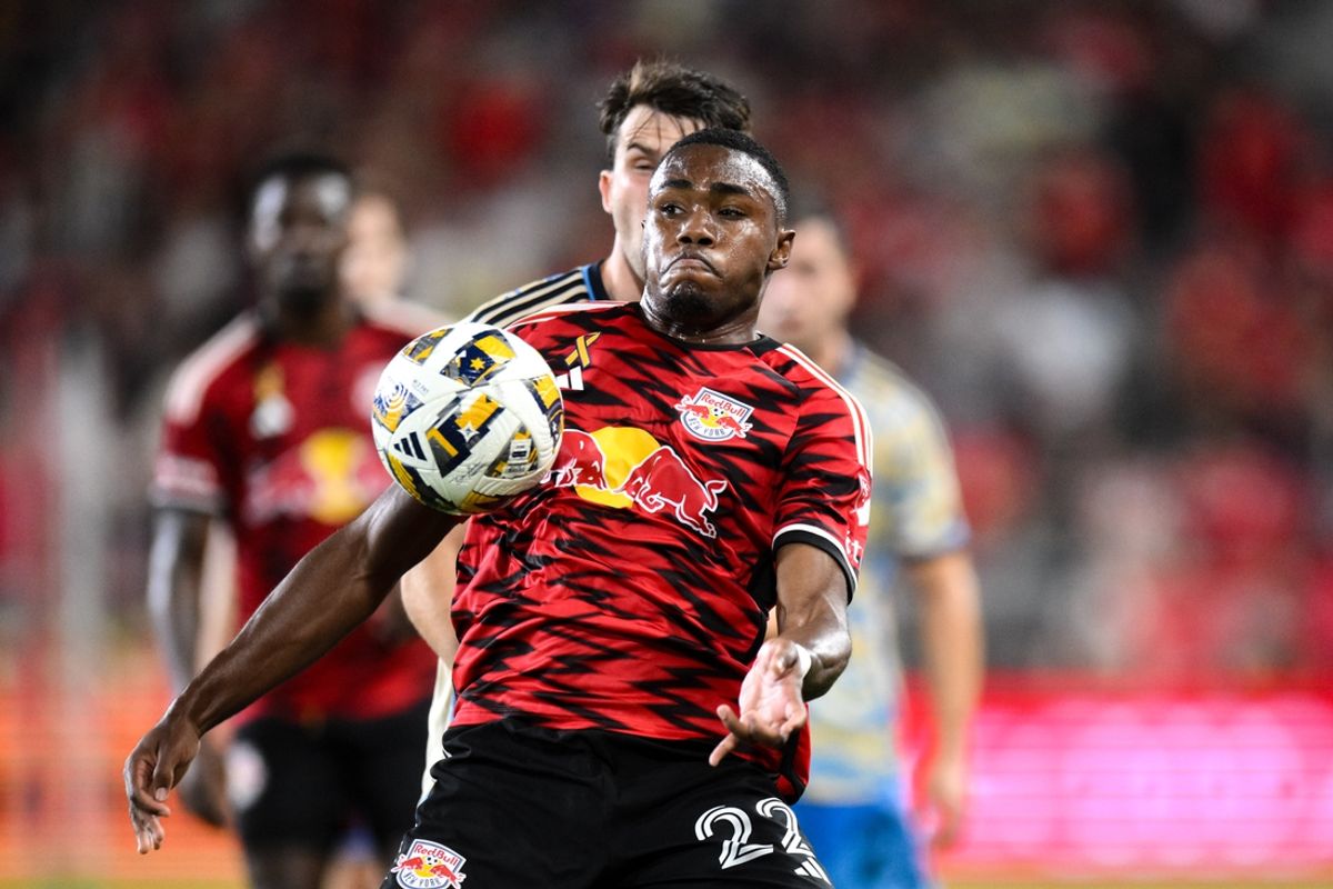 Aug 31, 2024; Harrison, New Jersey, USA; New York Red Bulls forward Serge Ngoma (22) controls the ball while being defended by Philadelphia Union defender Kai Wagner (27) during the second half at Red Bull Arena. Mandatory Credit: John Jones-Imagn Images