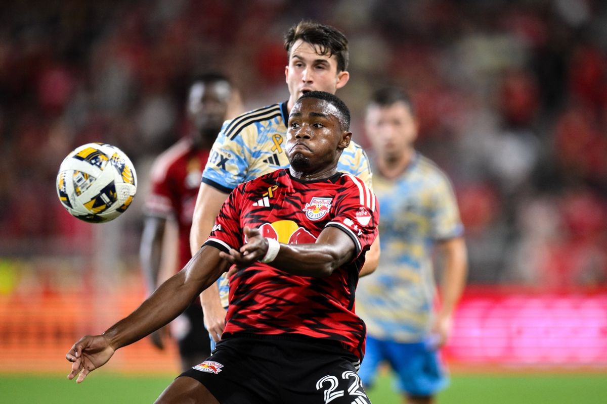 Aug 31, 2024; Harrison, New Jersey, USA; New York Red Bulls forward Serge Ngoma (22) controls the ball while being defended by Philadelphia Union defender Kai Wagner (27) during the second half at Red Bull Arena. Mandatory Credit: John Jones-Imagn Images