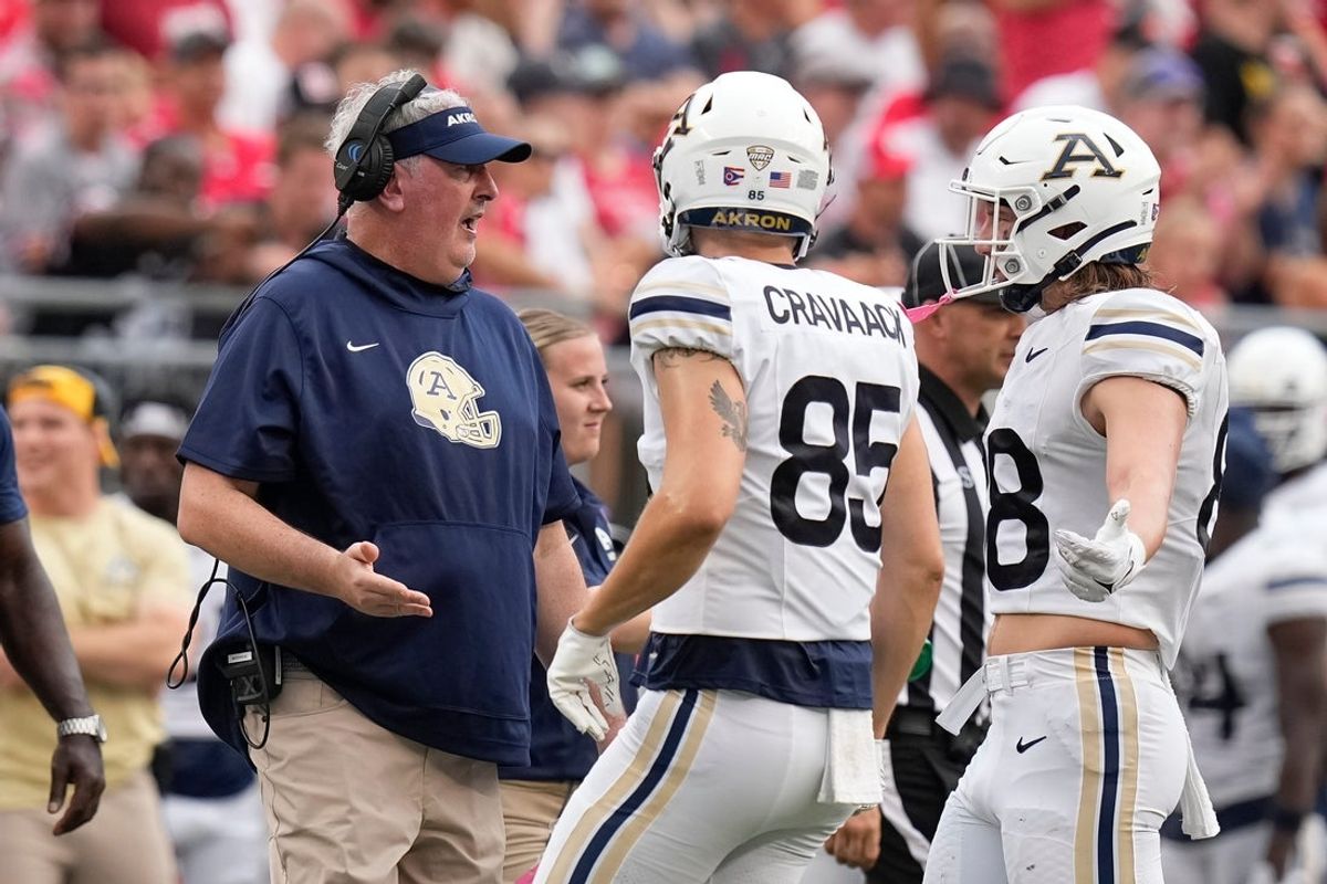 Aug 31, 2024; Columbus, OH, USA; Akron Zips head coach Joe Moorhead talks to tight end Jake Newell (88) and tight end Conner Cravaack (85) during the second half of the NCAA football game against the Ohio State Buckeyes at Ohio Stadium. Ohio State won 52-6.