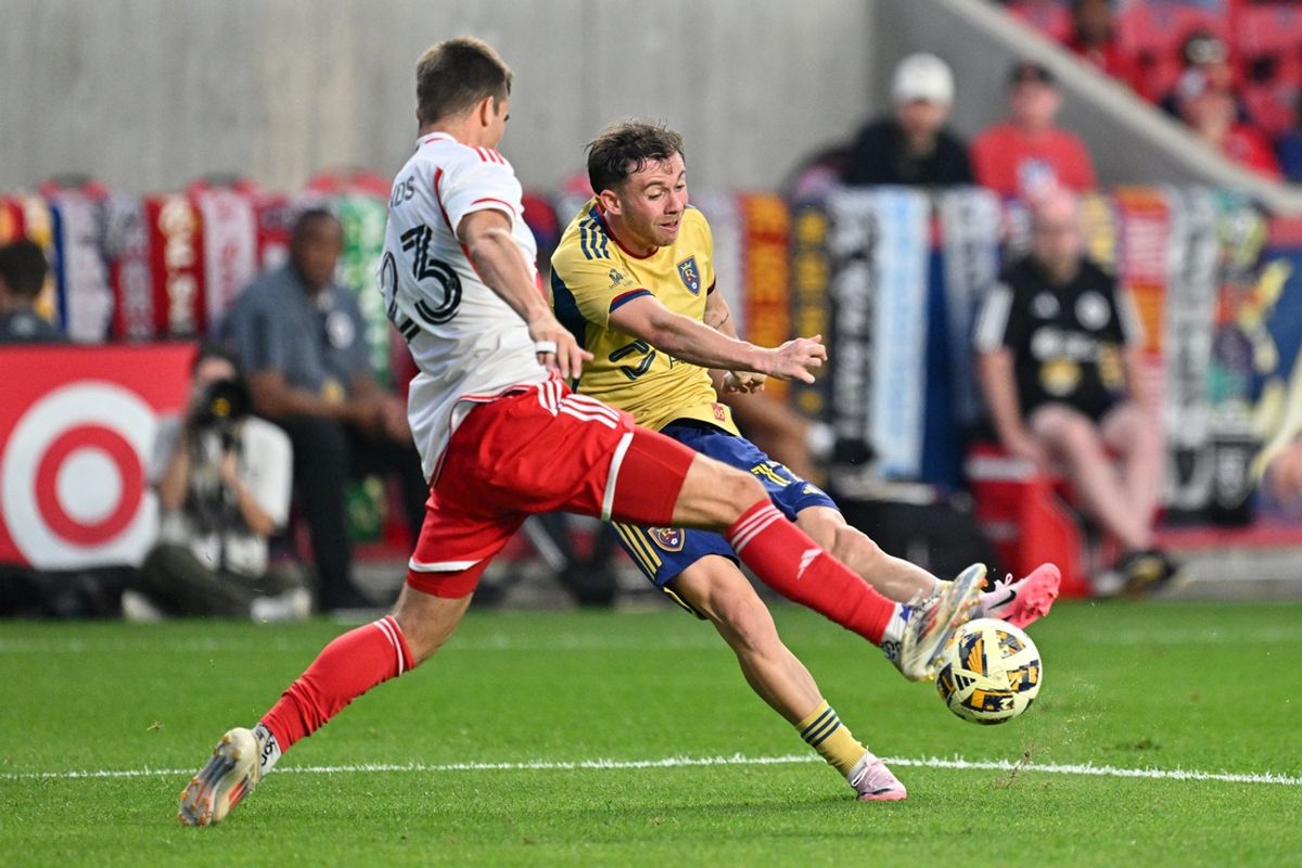 Aug 31, 2024; Sandy, Utah, USA; Real Salt Lake forward Lachlan Brook (17) kicks the ball against New England Revolution defender Will Sands (23) during the first half at America First Field. Mandatory Credit: Jamie Sabau-USA TODAY Sports