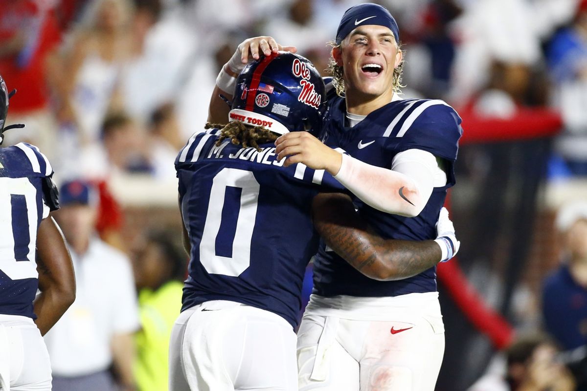 Aug 31, 2024; Oxford, Mississippi, USA; Mississippi Rebels quarterback Jaxson Dart (2) reacts with running back Matt Jones (0) after a touchdown against the Furman Paladins during the second half  at Vaught-Hemingway Stadium. Mandatory Credit: Petre Thomas-USA TODAY Sports