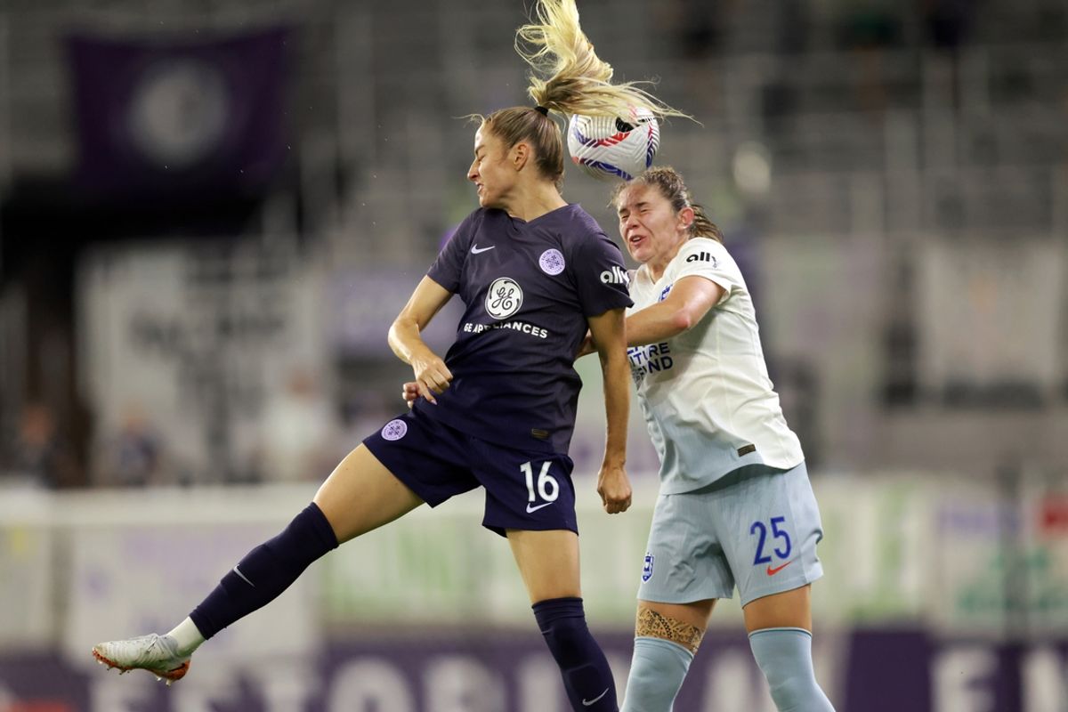 Aug 30, 2024; Louisville, Kentucky, USA; Racing Louisville FC forward Janine Beckie (16) and Seattle Reign FC defender Shae Holmes (25) jump to head the ball in the second half at Lynn Family Stadium. Mandatory Credit: EM Dash-USA TODAY Sports