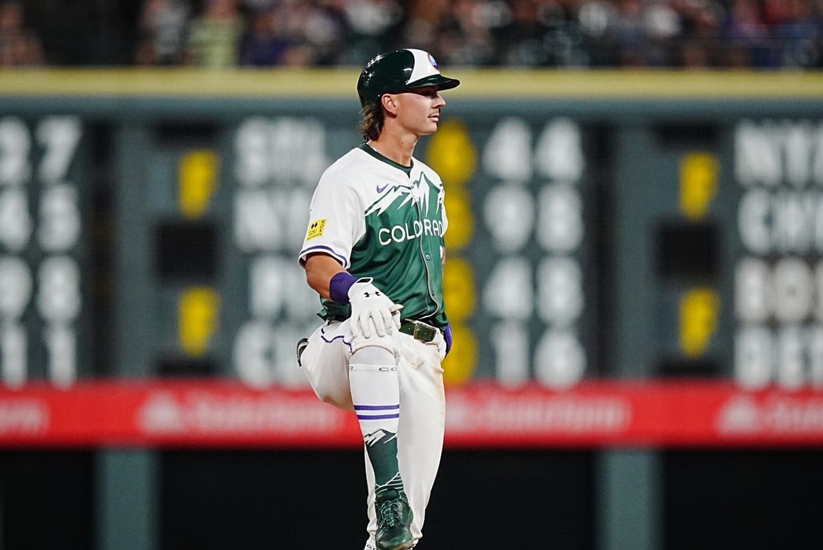 Aug 31, 2024; Denver, Colorado, USA; Colorado Rockies right fielder Jordan Beck (27) celebrates his two RBI single in the eighth inning against the Colorado Rockies at Coors Field. Mandatory Credit: Ron Chenoy-USA TODAY Sports