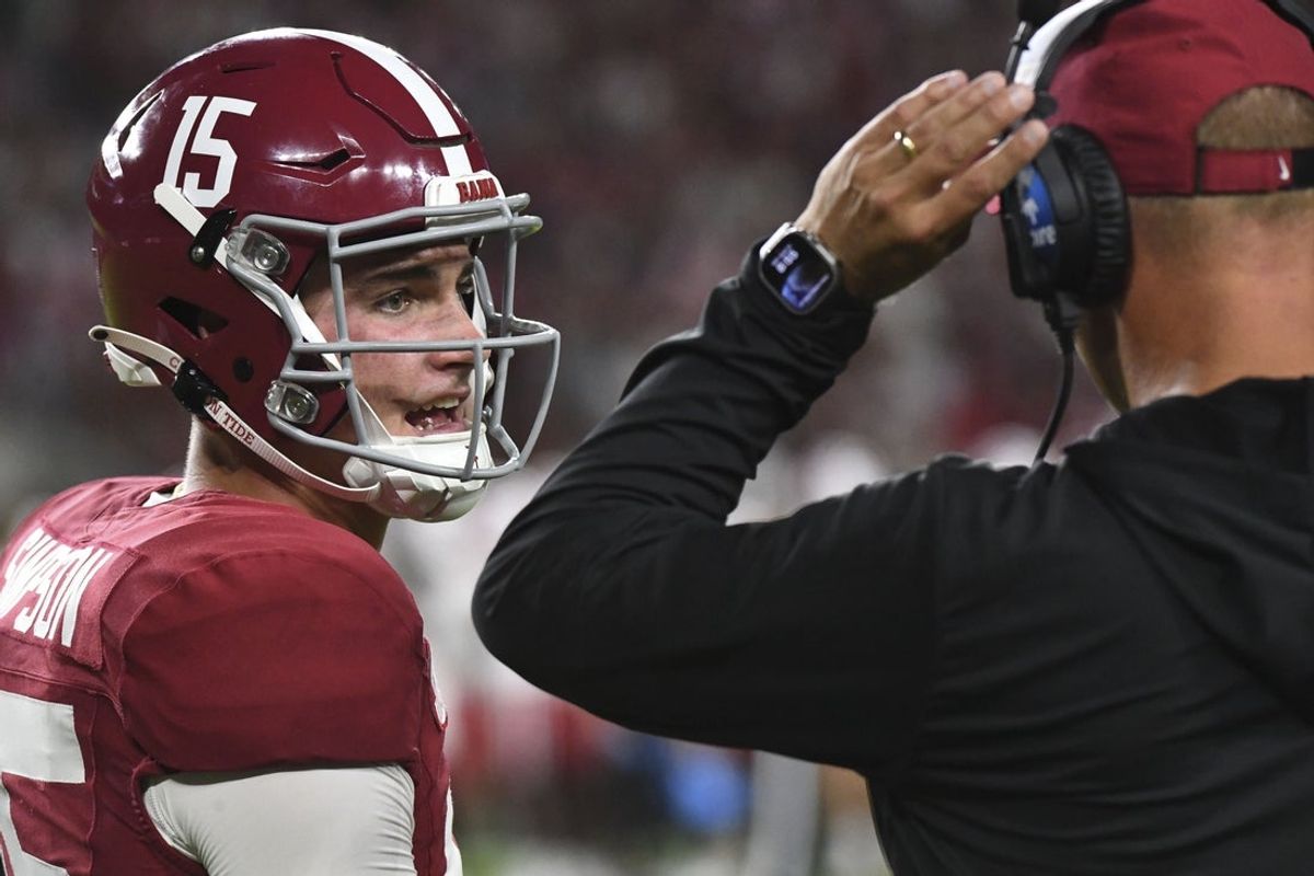 Aug 31, 2024; Tuscaloosa, Alabama, USA;  Alabama Crimson Tide quarterback Ty Simpson (15) talks with Alabama Crimson Tide head coach Kalen DeBoer  at Bryant-Denny Stadium during the game between the Alabama Crimson Tide and the Western Kentucky Hilltoppers. Alabama defeated Western Kentucky 63-0. Mandatory Credit: Gary Cosby Jr.-Imagn Images