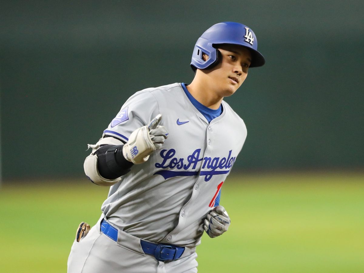 Los Angeles Dodgers designated hitter Shohei Ohtani (17) celebrates while rounding third after hitting a solo home run at Chase Field on Aug. 31, 2024, in Phoenix.