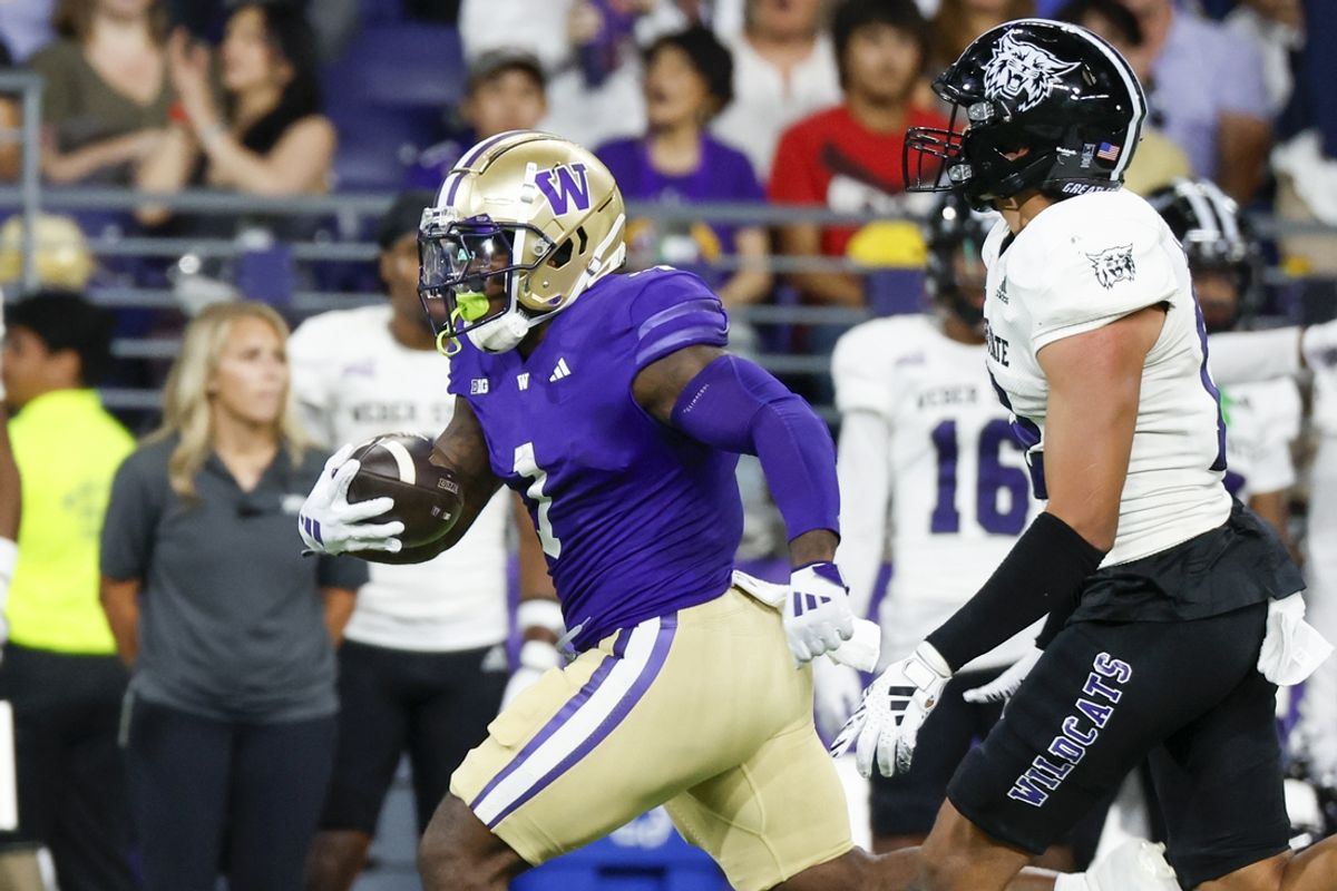Aug 31, 2024; Seattle, Washington, USA; Washington Huskies running back Jonah Coleman (1) rushes against the Weber State Wildcats during the first quarter at Alaska Airlines Field at Husky Stadium. Mandatory Credit: Joe Nicholson-USA TODAY Sports
