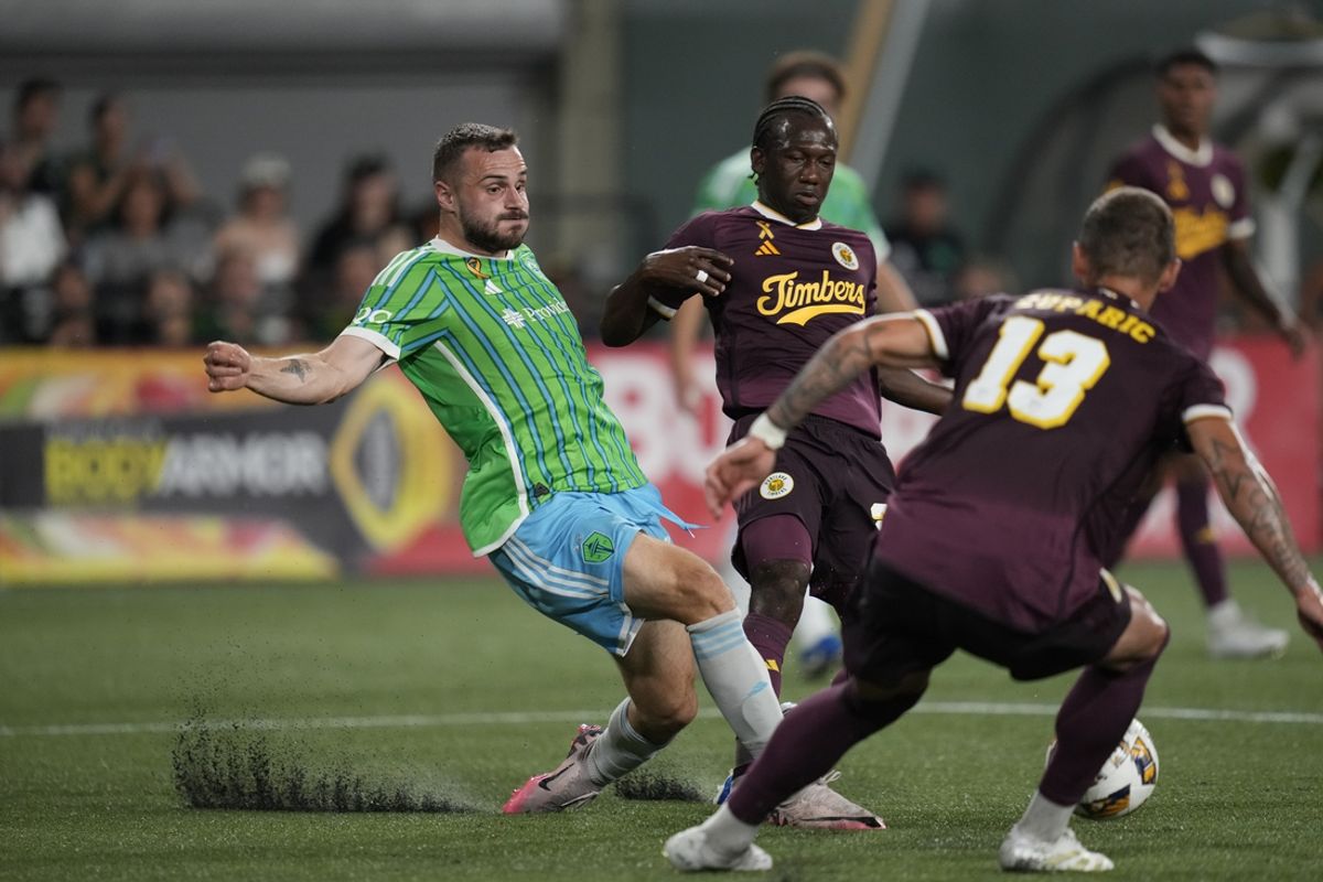 Aug 31, 2024; Portland, Oregon, USA; Seattle Sounders forward Jordan Morris (13) battles Portland Timbers midfielder Diego Chara (21) for the ball in the first half at Providence Park. Mandatory Credit: Soobum Im-USA TODAY Sports
