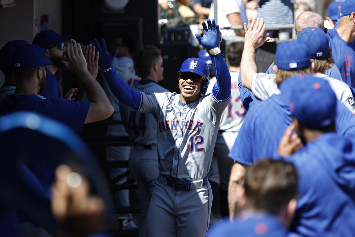 Sep 1, 2024; Chicago, Illinois, USA; New York Mets shortstop Francisco Lindor (12) celebrates with teammates in the dugout after hitting a solo home run against the Chicago White Sox during the fourth inning at Guaranteed Rate Field. Mandatory Credit: Kamil Krzaczynski-USA TODAY Sports