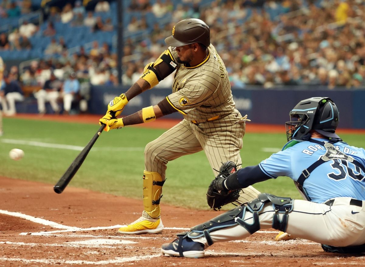 Sep 1, 2024; St. Petersburg, Florida, USA; San Diego Padres first base Luis Arraez (4) singles against the Tampa Bay Rays during the third inning at Tropicana Field. Mandatory Credit: Kim Klement Neitzel-USA TODAY Sports