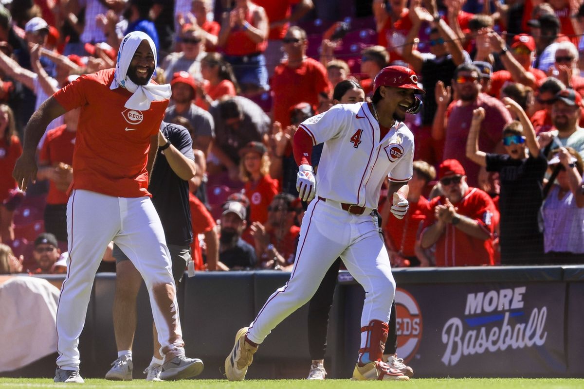 Sep 1, 2024; Cincinnati, Ohio, USA; Cincinnati Reds pinch hitter Santiago Espinal (4) celebrates after the victory over the Milwaukee Brewers at Great American Ball Park. Mandatory Credit: Katie Stratman-USA TODAY Sports