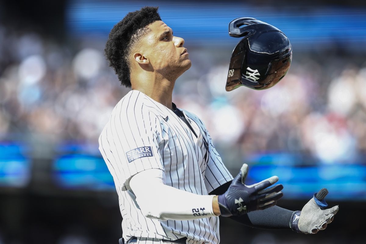 Sep 1, 2024; Bronx, New York, USA;  New York Yankees right fielder Juan Soto (22) tosses his helmet after flying out to end the sixth inning against the St. Louis Cardinals at Yankee Stadium. Mandatory Credit: Wendell Cruz-USA TODAY Sports