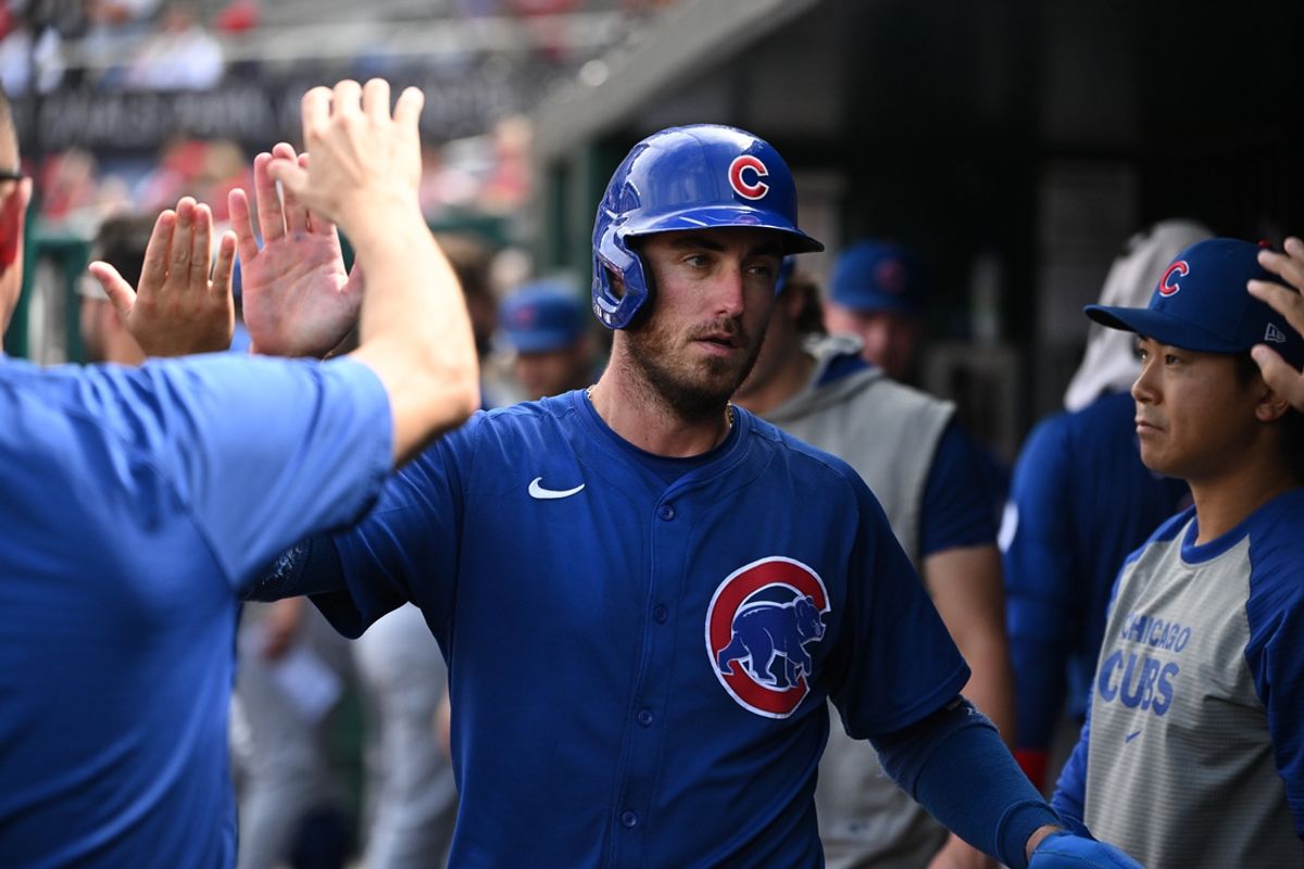 Sep 1, 2024; Washington, District of Columbia, USA; Chicago Cubs center fielder Cody Bellinger (24) celebrates in the dugout after scoring a run against the Washington Nationals during the seventh inning at Nationals Park. Mandatory Credit: Rafael Suanes-USA TODAY Sports