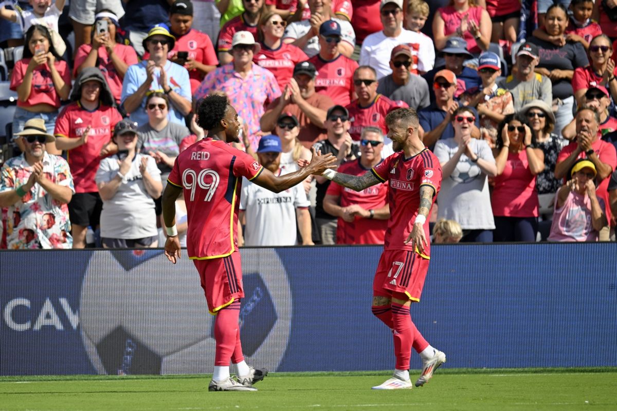 Sep 1, 2024; St. Louis, Missouri, USA; St. Louis CITY SC midfielder Marcel Hartel (17) celebrates with forward Jayden Reid (99) after scoring a goal against the LA Galaxy during the second half at CITYPARK. Mandatory Credit: Scott Rovak-USA TODAY Sports