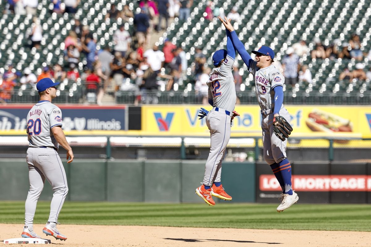 Sep 1, 2024; Chicago, Illinois, USA; New York Mets shortstop Francisco Lindor (12) and outfielder Brandon Nimmo (9) celebrate after defeating the Chicago White Sox in a baseball game at Guaranteed Rate Field. Mandatory Credit: Kamil Krzaczynski-USA TODAY Sports