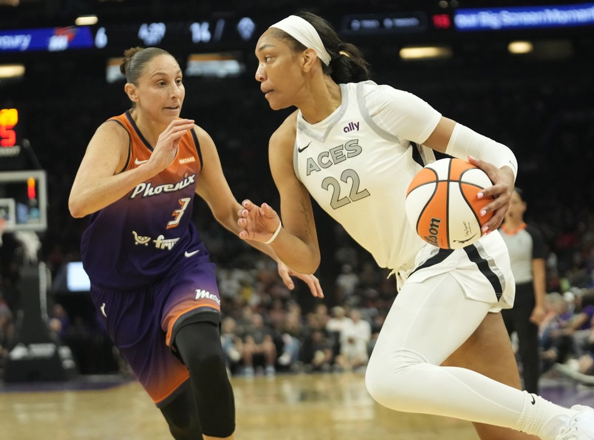 Phoenix Mercury guard Diana Taurasi (3) defends against Las Vegas Aces center A'ja Wilson (22) during the first quarter at Footprint Center on Sept. 1, 2024, in Phoenix.