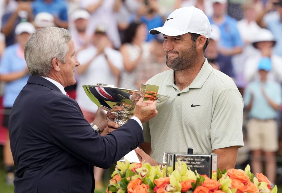 Sep 1, 2024; Atlanta, Georgia, USA; Sep 1, 2024; Atlanta, Georgia, USA; PGA TOUR Commissioner Jay Monahan presents Scottie Scheffler the FedEx Cup after winning the TOUR Championship golf tournament. Mandatory Credit: John David Mercer-Imagn Images