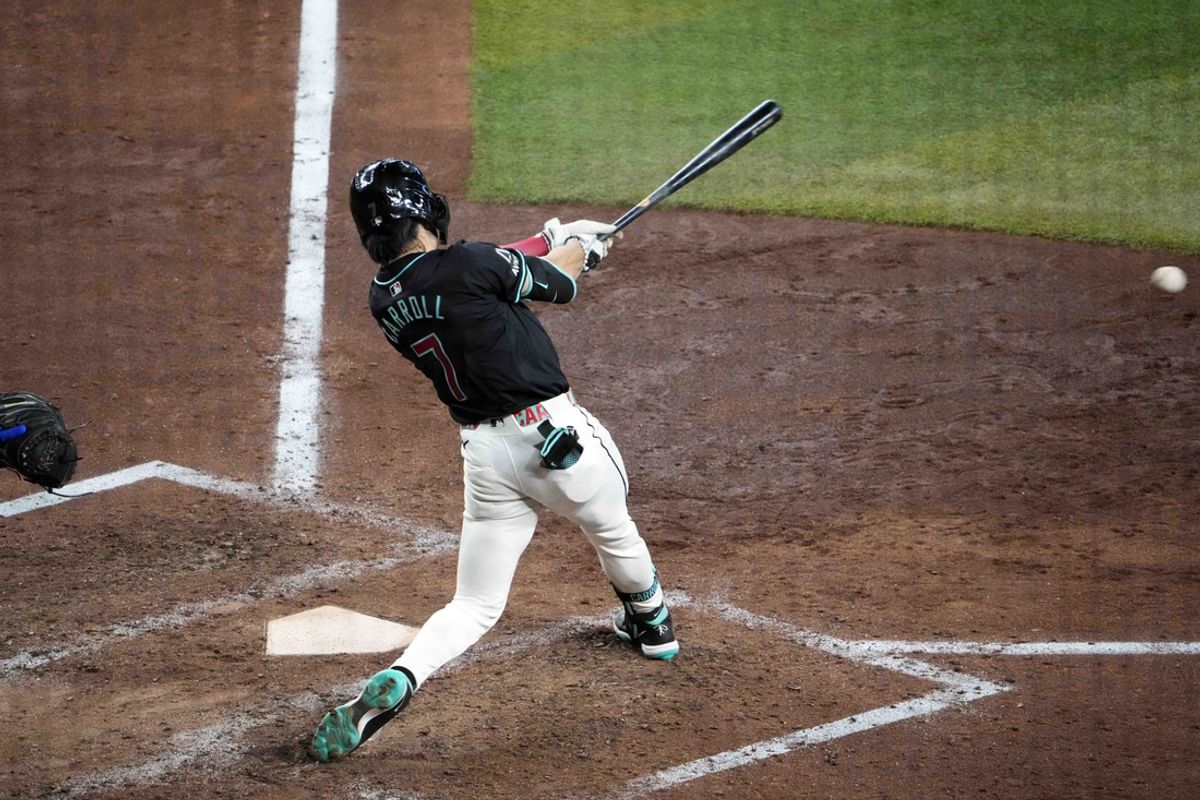 Sep 1, 2024; Phoenix, Arizona, USA; Arizona Diamondbacks outfielder Corbin Carroll (7) hits a single against the Los Angeles Dodgers during the sixth inning at Chase Field. Mandatory Credit: Joe Camporeale-USA TODAY Sports