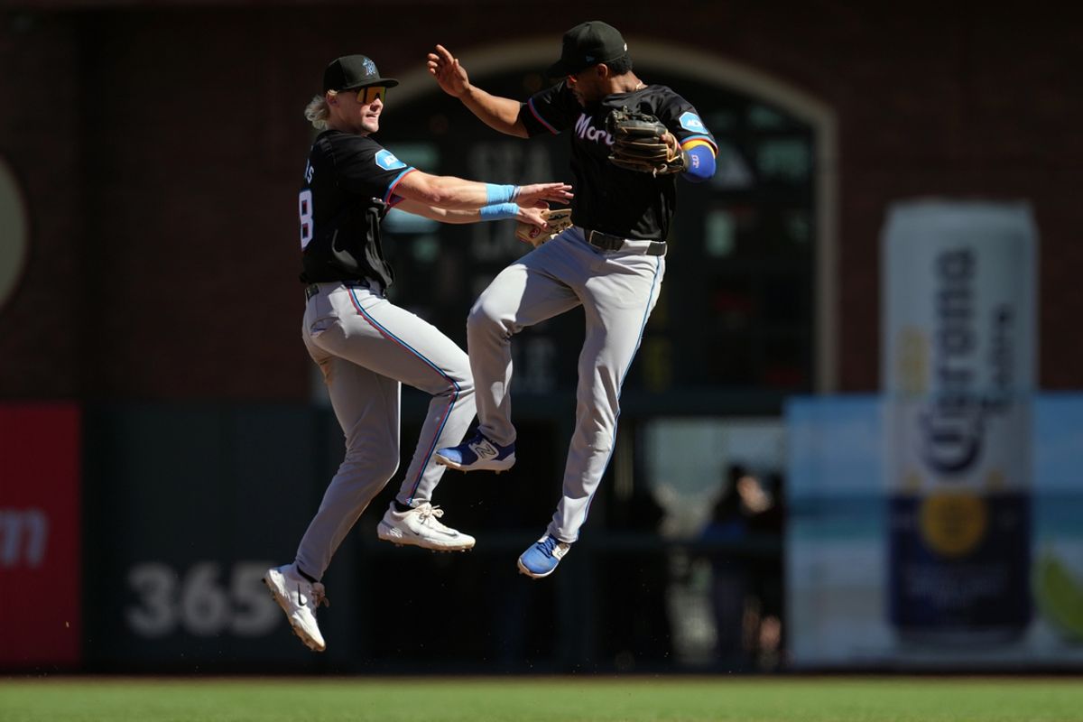 Sep 1, 2024; San Francisco, California, USA; Miami Marlins left fielder Kyle Stowers (left) celebrates with shortstop Otto Lopez (right) after defeating the San Francisco Giants at Oracle Park. Mandatory Credit: Darren Yamashita-USA TODAY Sports