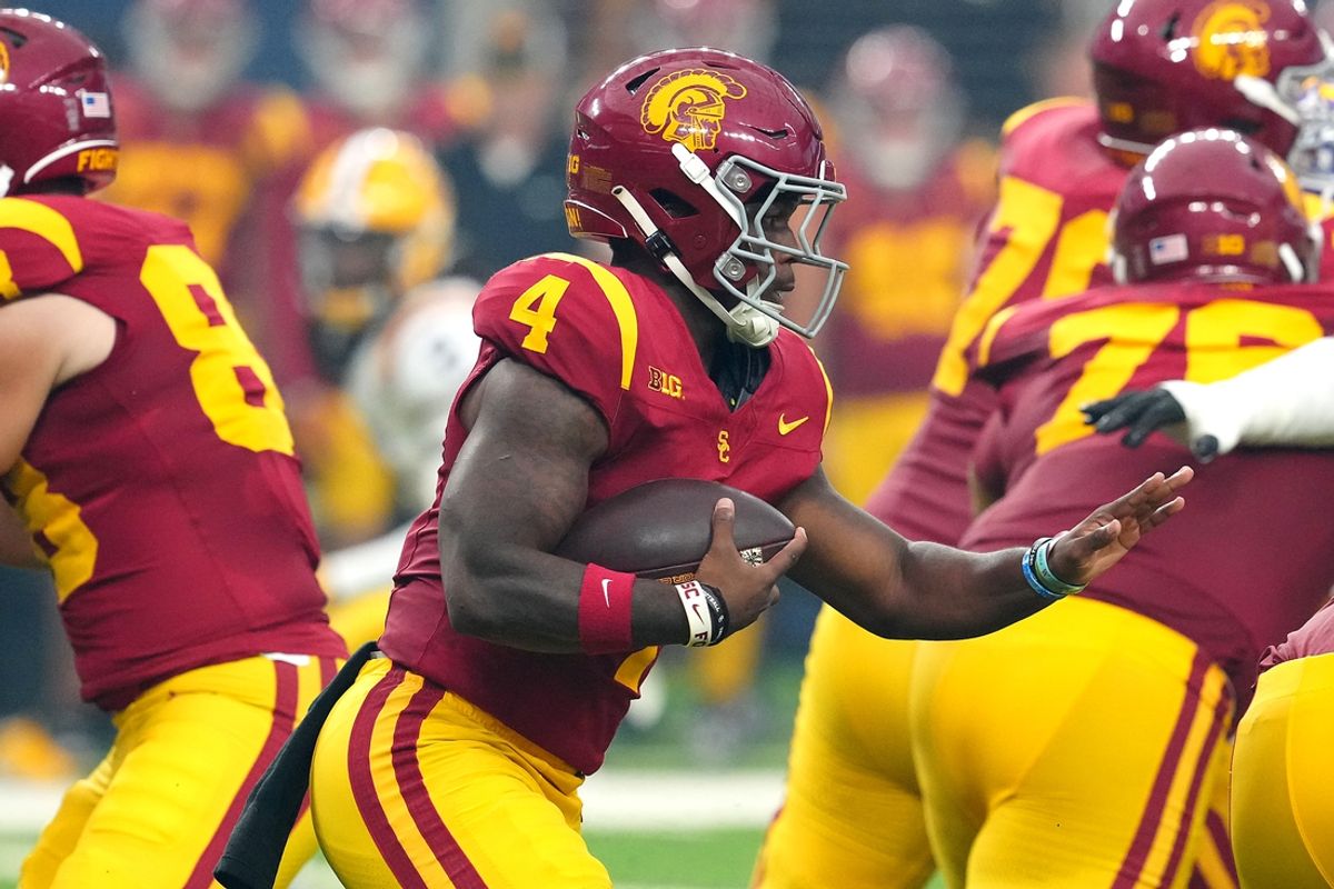 Sep 1, 2024; Paradise, Nevada, USA; Southern California Trojans running back Woody Marks (4) rushes against the LSU Tigers during the first quarter at Allegiant Stadium. Mandatory Credit: Stephen R. Sylvanie-Imagn Images