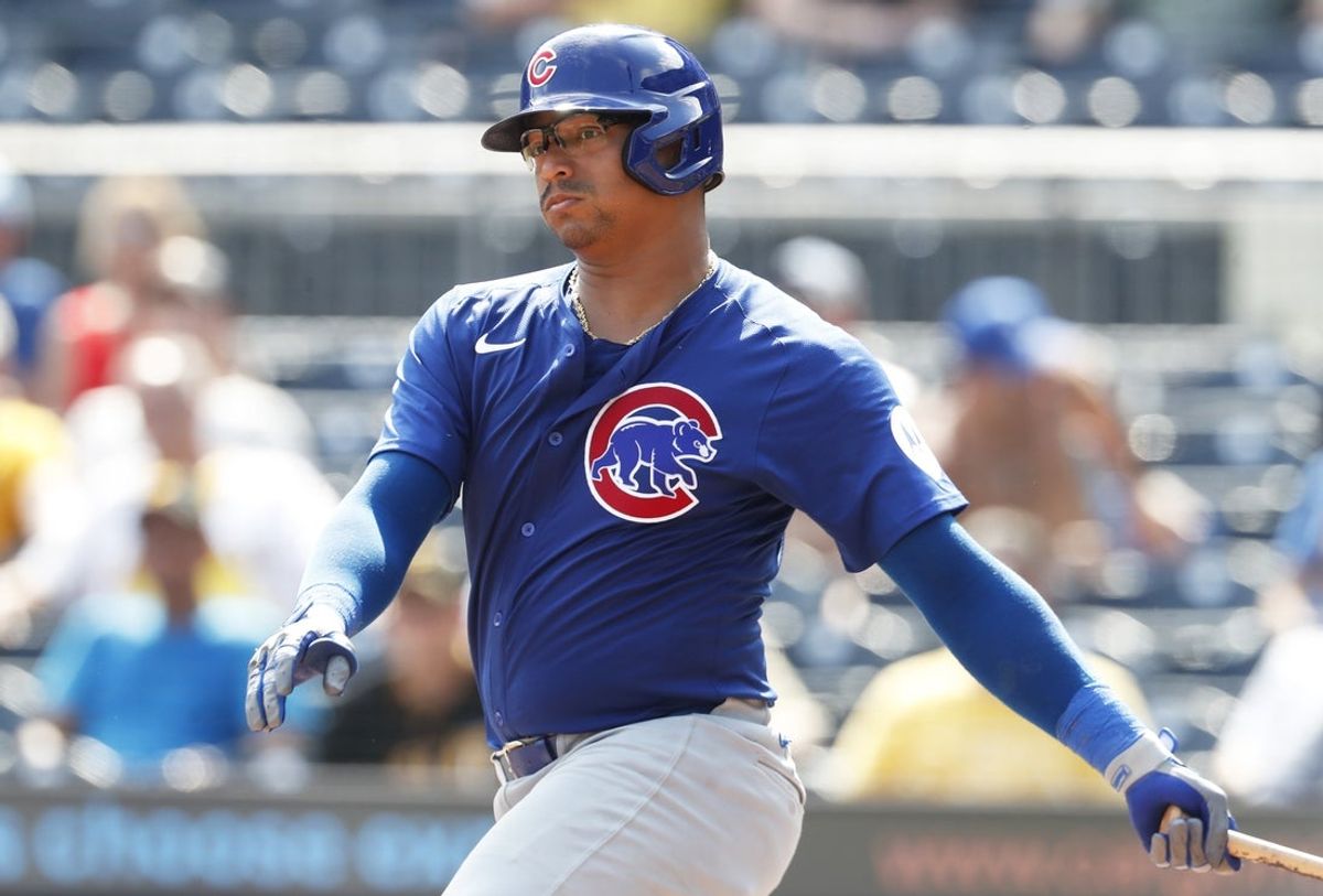 Aug 28, 2024; Pittsburgh, Pennsylvania, USA;  against Chicago Cubs catcher Christian Bethancourt (60) hits an RBI single against the Pittsburgh Pirates during the eighth inning at PNC Park. Mandatory Credit: Charles LeClaire-Imagn Images
