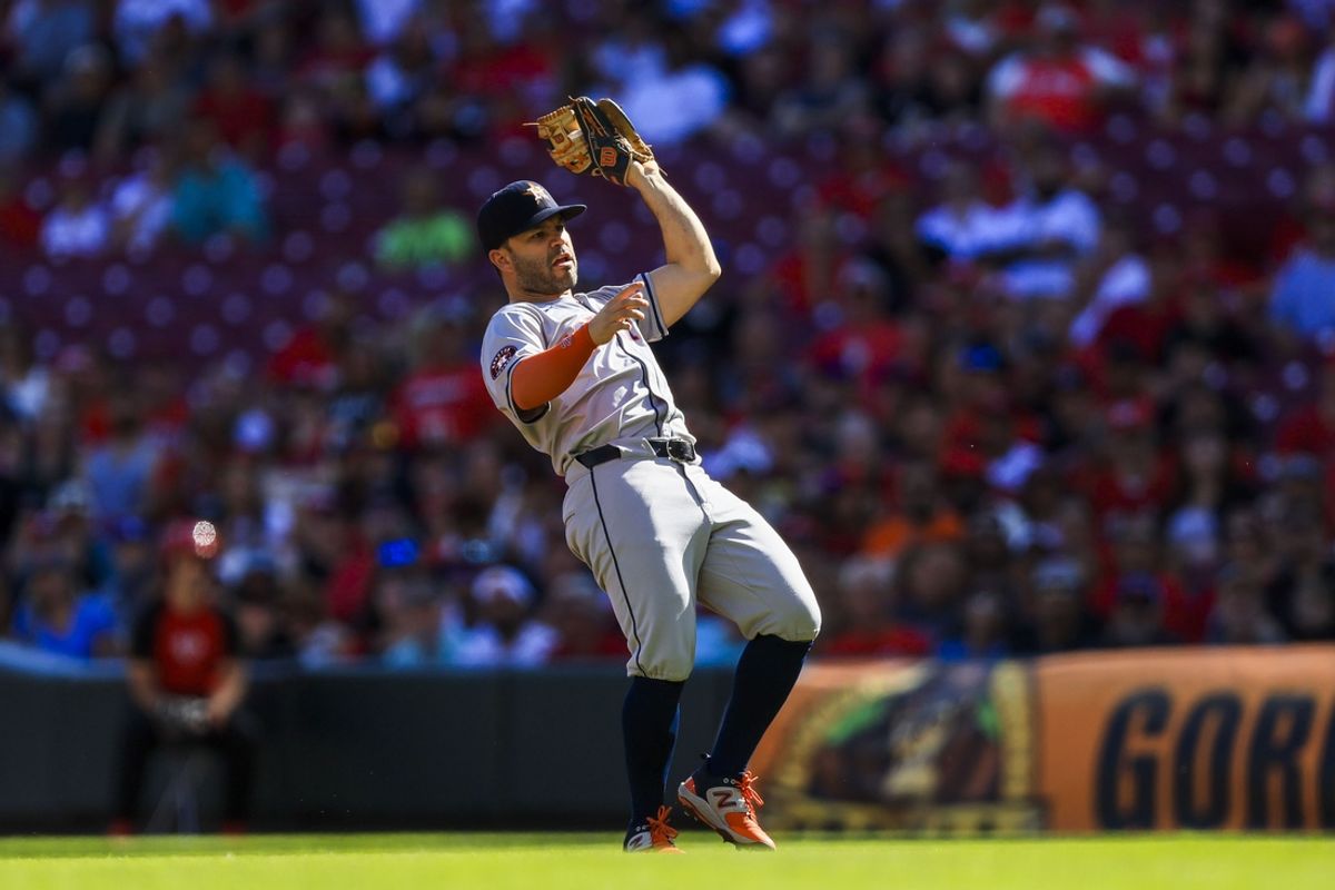 Houston Astros second baseman Jose Altuve (27) catches a pop up hit by Cincinnati Reds outfielder Spencer Steer (not pictured) in the first inning at Great American Ball Park. Mandatory Credit: Katie Stratman-Imagn Images