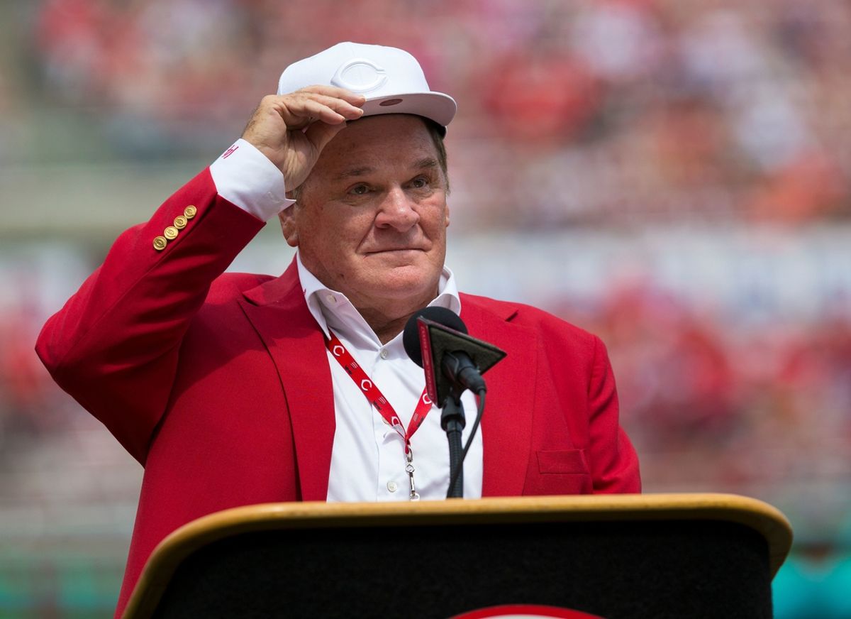 An emotional Cincinnati Reds hall of famer Pete Rose adjusts his cap as he takes the microphone during a pregame ceremony for the unveiling of Pete Rose's bronze statue being installed outside the stadium before the MLB National League game between the Cincinnati Reds and the Los Angeles Dodgers at Great American Ball Park in downtown Cincinnati on Saturday, June 17, 2017.Pete Rose