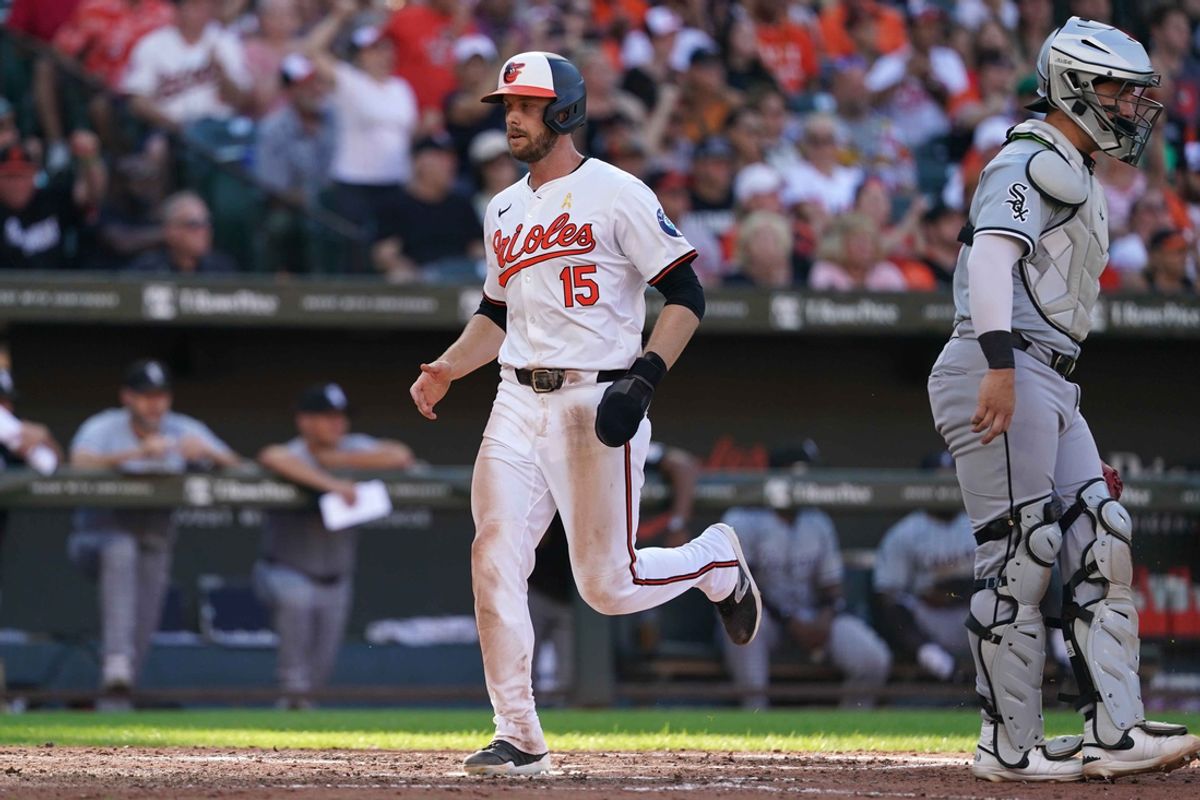 Sep 2, 2024; Baltimore, Maryland, USA; Baltimore Orioles outfielder Austin Slater (15) scores a run during the fifth inning against the Chicago White Sox at Oriole Park at Camden Yards. Mandatory Credit: Mitch Stringer-USA TODAY Sports