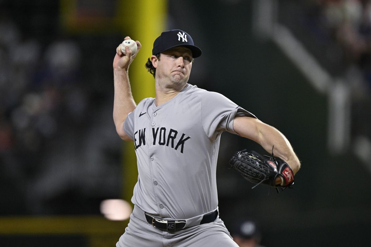 Sep 2, 2024; Arlington, Texas, USA; New York Yankees starting pitcher Gerrit Cole (45) pitches against the Texas Rangers during the first inning at Globe Life Field. Mandatory Credit: Jerome Miron-Imagn Images