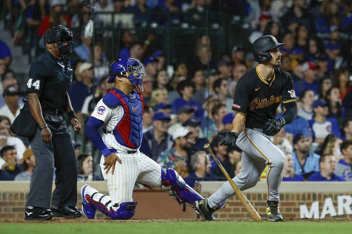 Sep 2, 2024; Chicago, Illinois, USA; Pittsburgh Pirates outfielder Bryan Reynolds (10) hits a three-run home run against the Chicago Cubs during the eight inning against the Chicago Cubs at Wrigley Field. Mandatory Credit: Kamil Krzaczynski-USA TODAY Sports